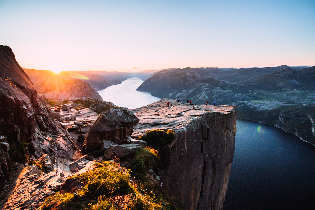 Warm orange sunrise at the Preikestolen in the summer in Norway